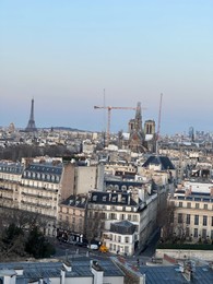 Beautiful buildings and Eiffel tower in Paris, view from hotel window