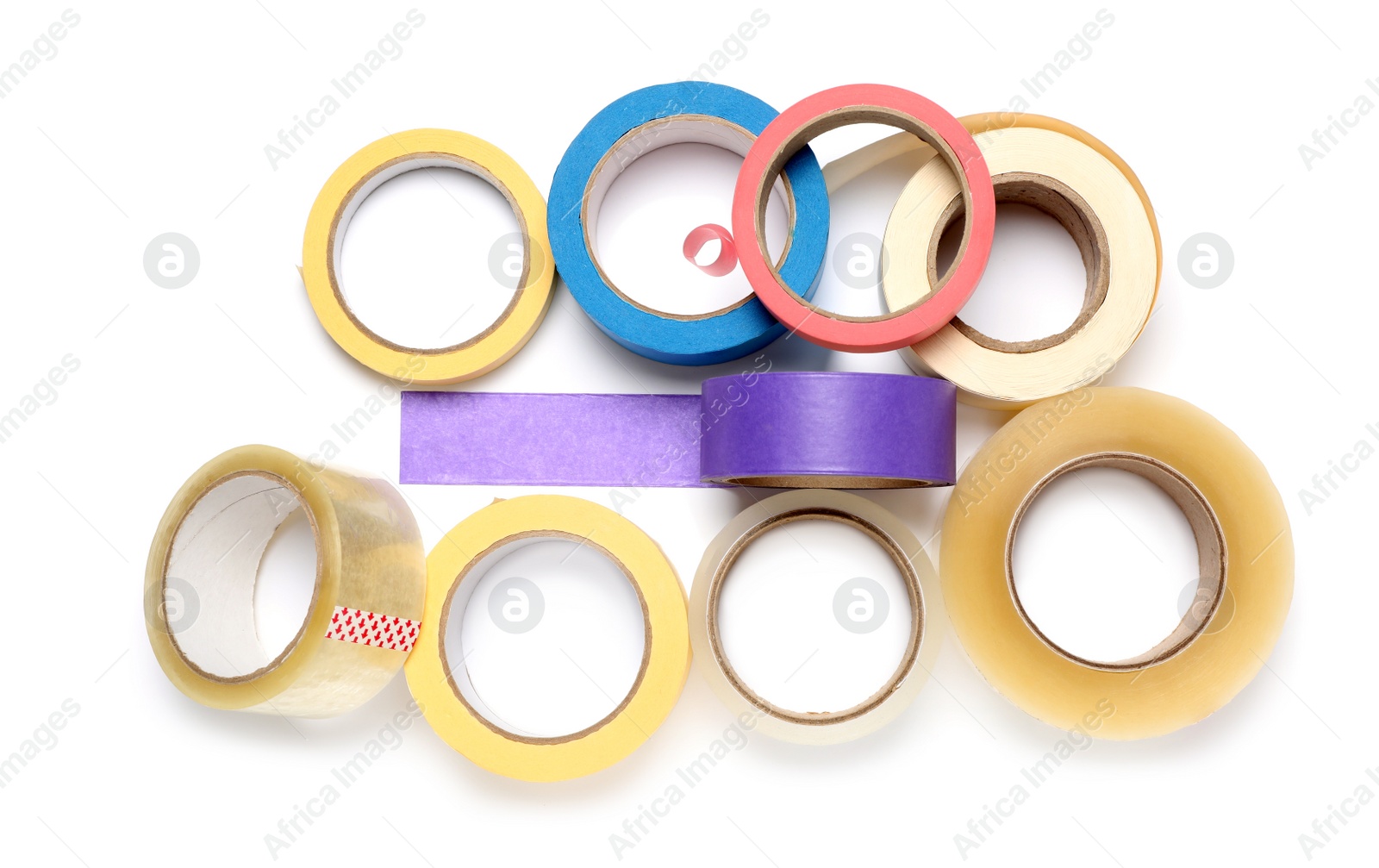 Photo of Many different rolls of adhesive tape on white background, top view