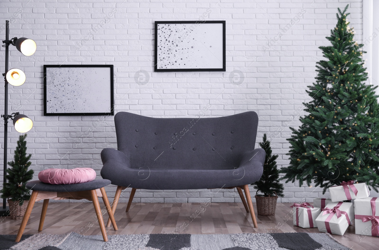 Photo of Living room interior with beautiful Christmas tree and comfortable sofa