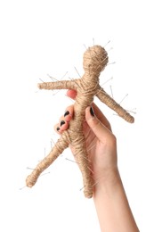 Woman holding voodoo doll with pins on white background, closeup