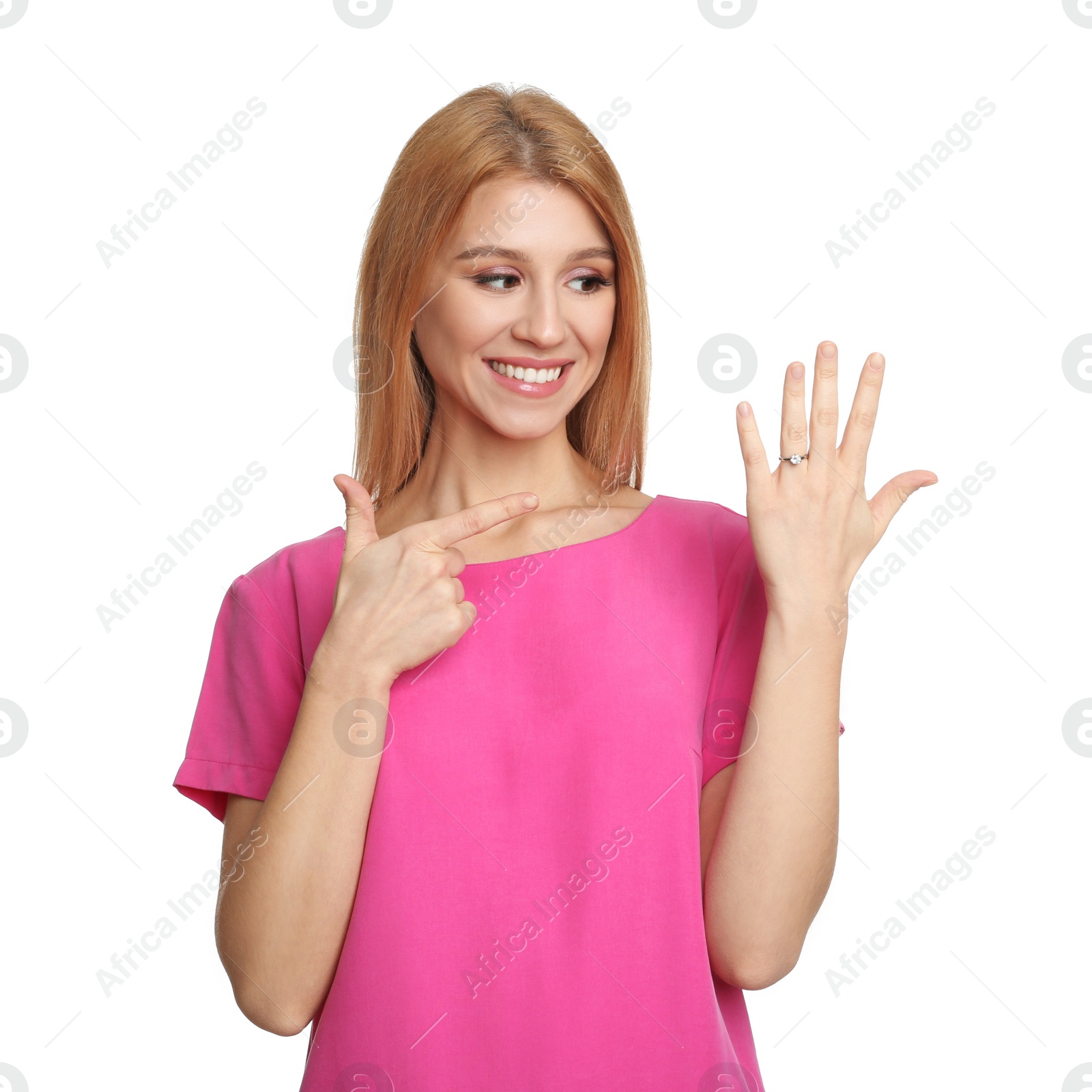 Photo of Excited woman with engagement ring on white background