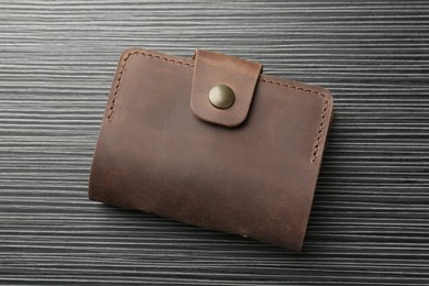 Photo of Leather business card holder on grey table, top view