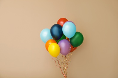 Bunch of bright balloons on color background. Celebration time