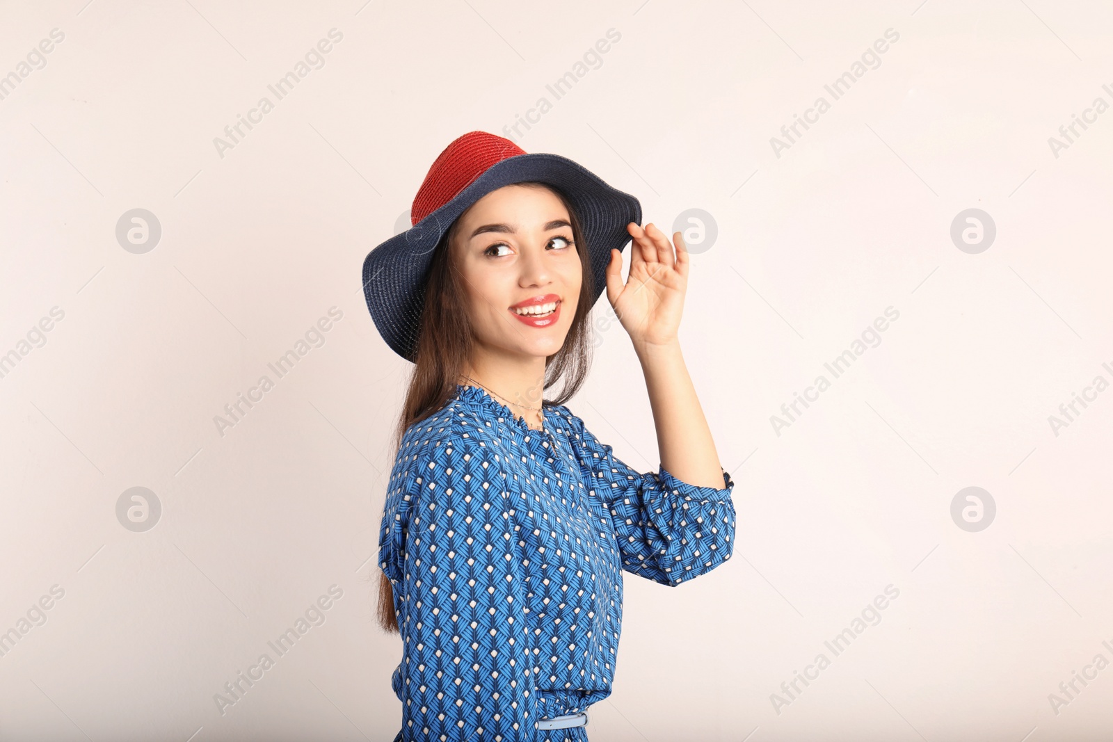 Photo of Portrait of beautiful young woman in stylish dress on white background