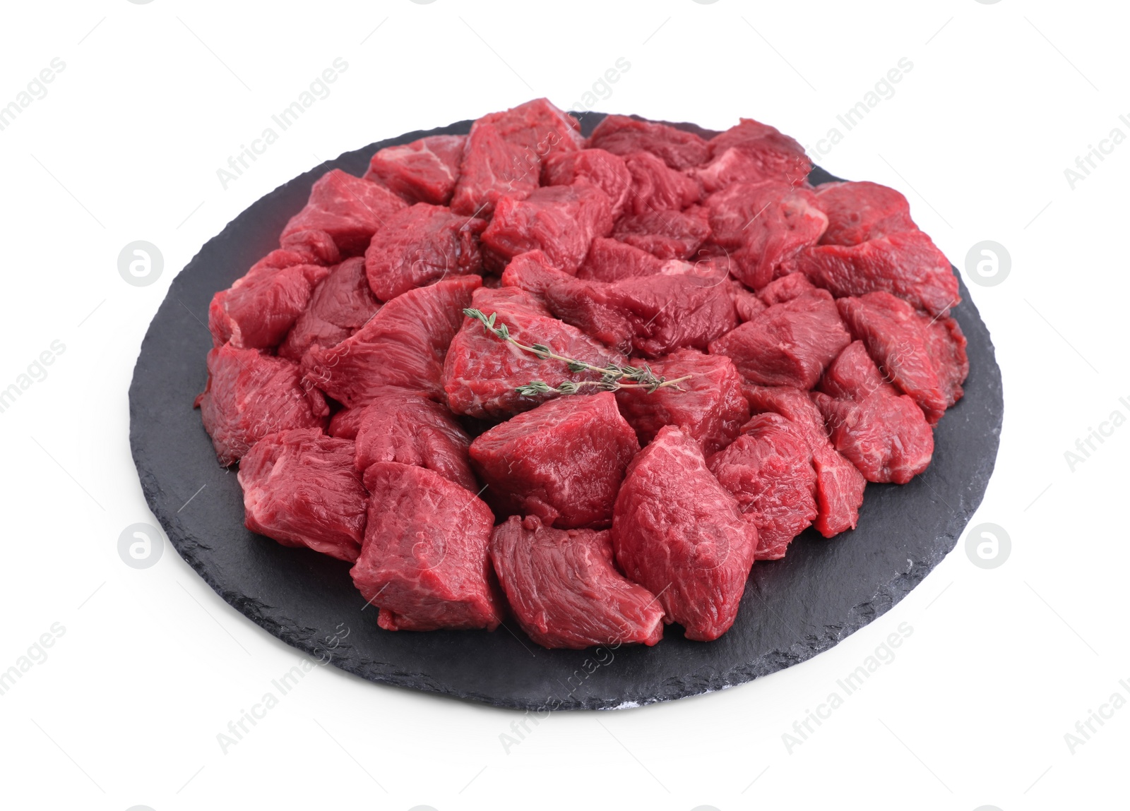 Photo of Pieces of raw beef meat and thyme sprigs isolated on white