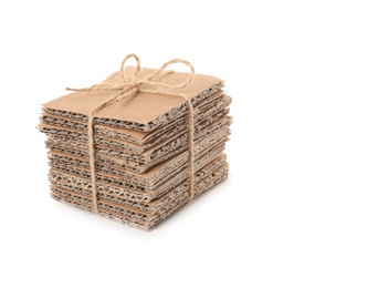 Photo of Stack of cardboard pieces on white background. Recyclable material