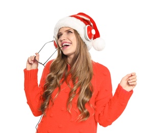 Photo of Happy young woman listening to Christmas music on white background