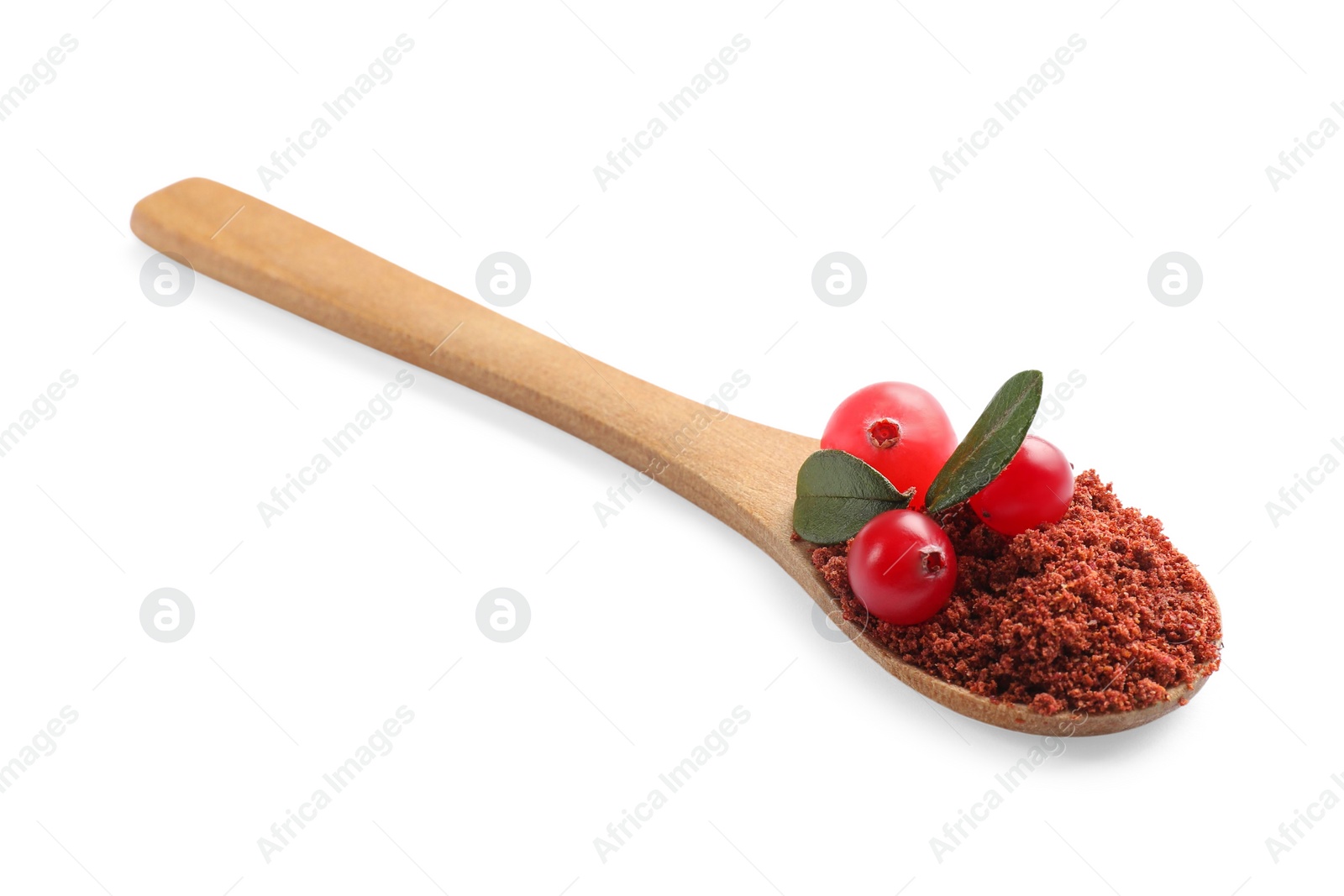 Photo of Wooden spoon with dried cranberry powder, fresh berries and green leaves isolated on white