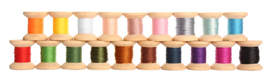 Set of colorful sewing threads on white background