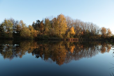 Picturesque view of lake and trees on autumn day