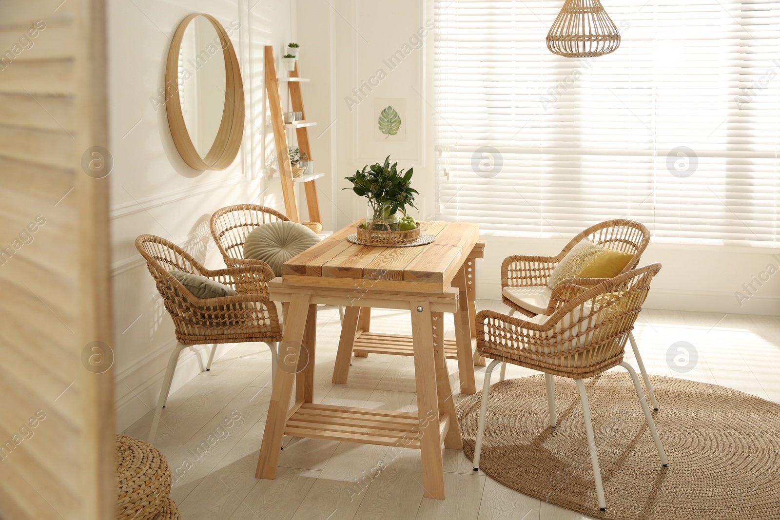 Photo of Stylish wooden dining table and chairs in room. Interior design