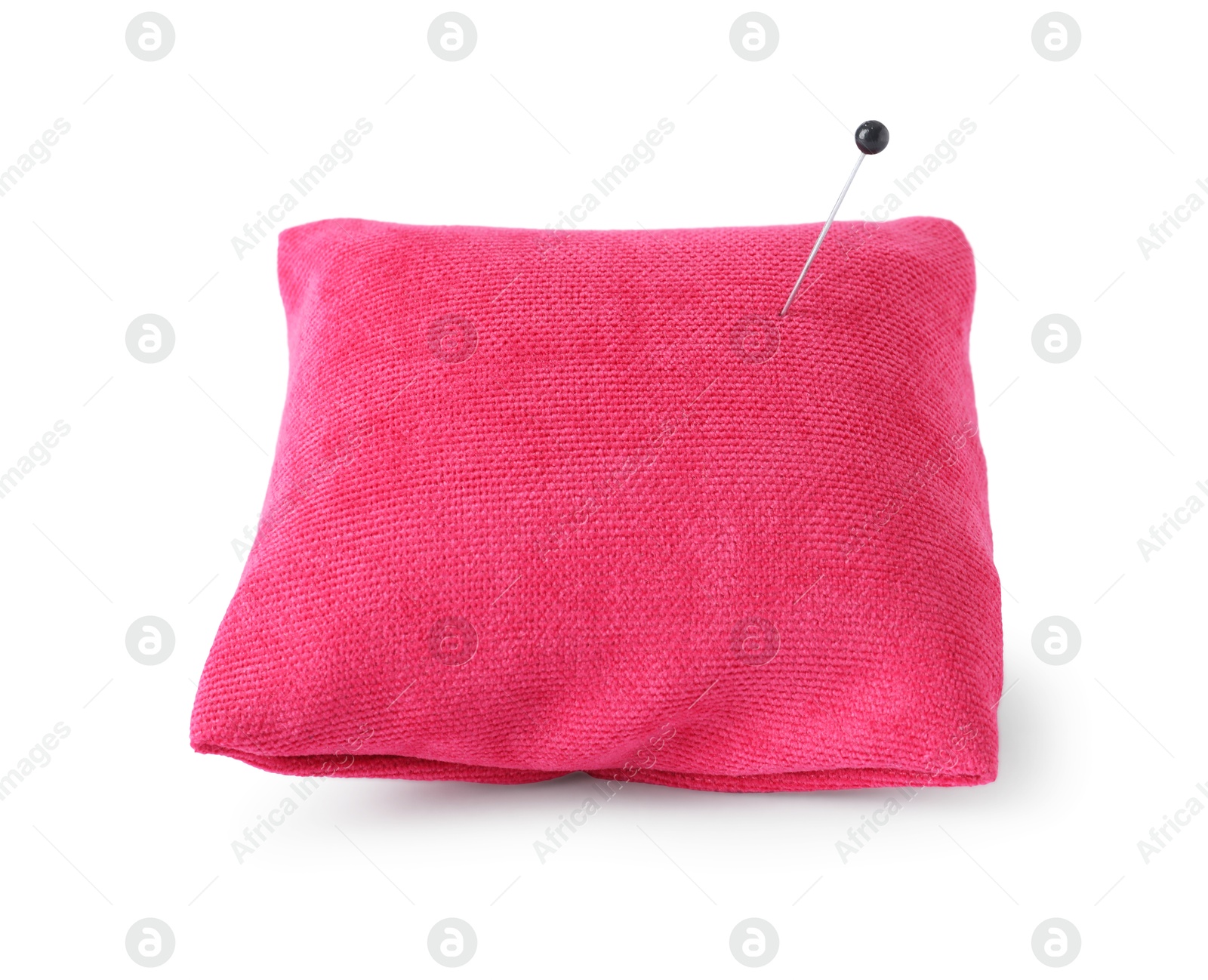 Photo of Pink pincushion with sewing pin isolated on white