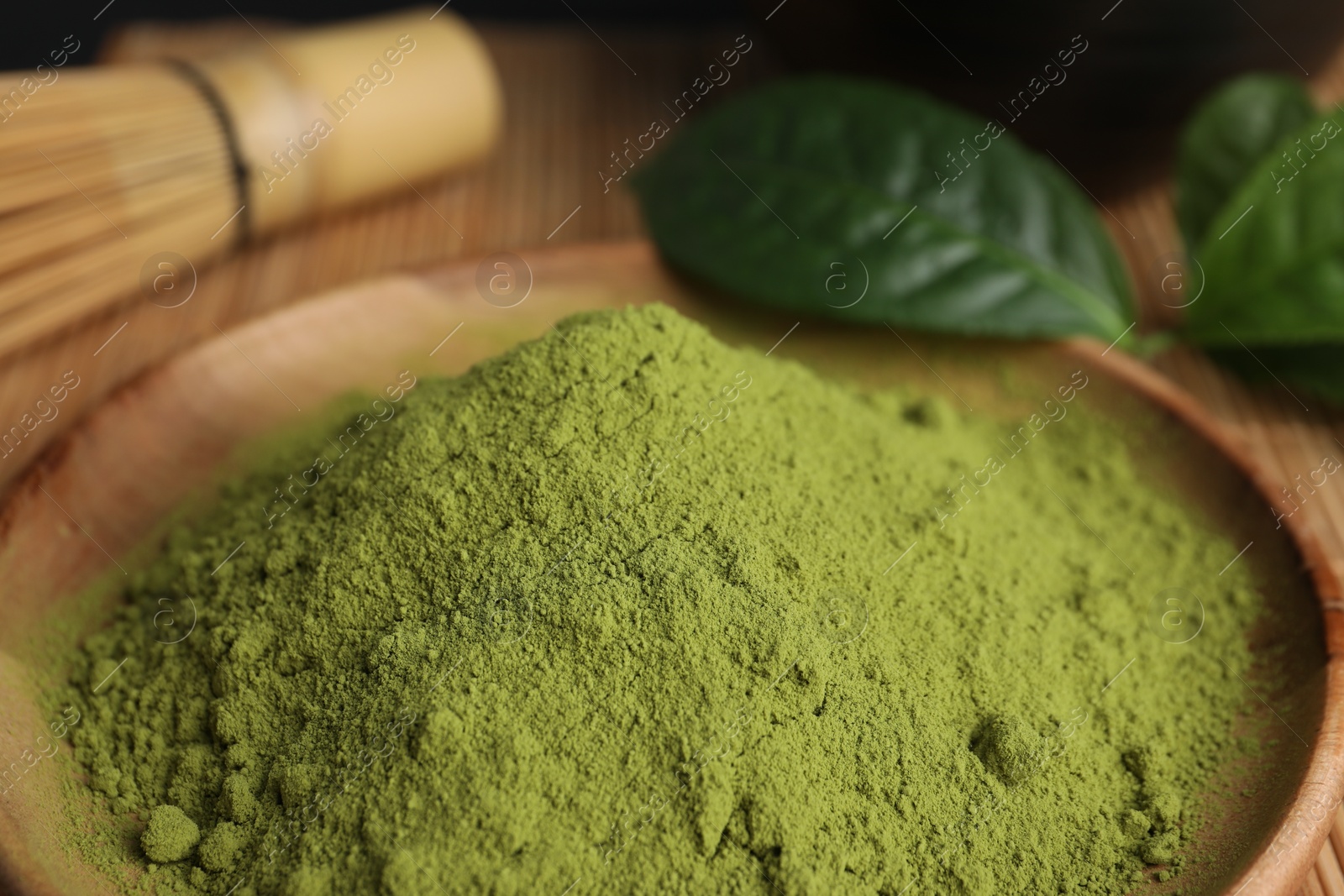 Photo of Green matcha powder on plate, closeup view