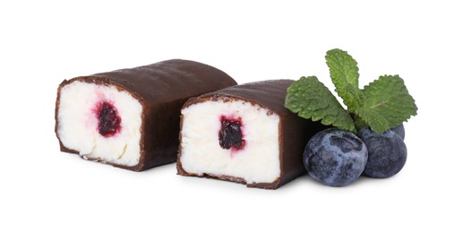 Photo of Cut glazed curds with blueberry filling isolated on white