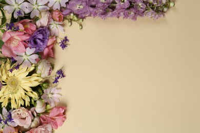 Flat lay composition with different beautiful flowers on beige background, space for text