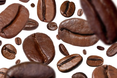 Image of Roasted coffee beans falling o white background