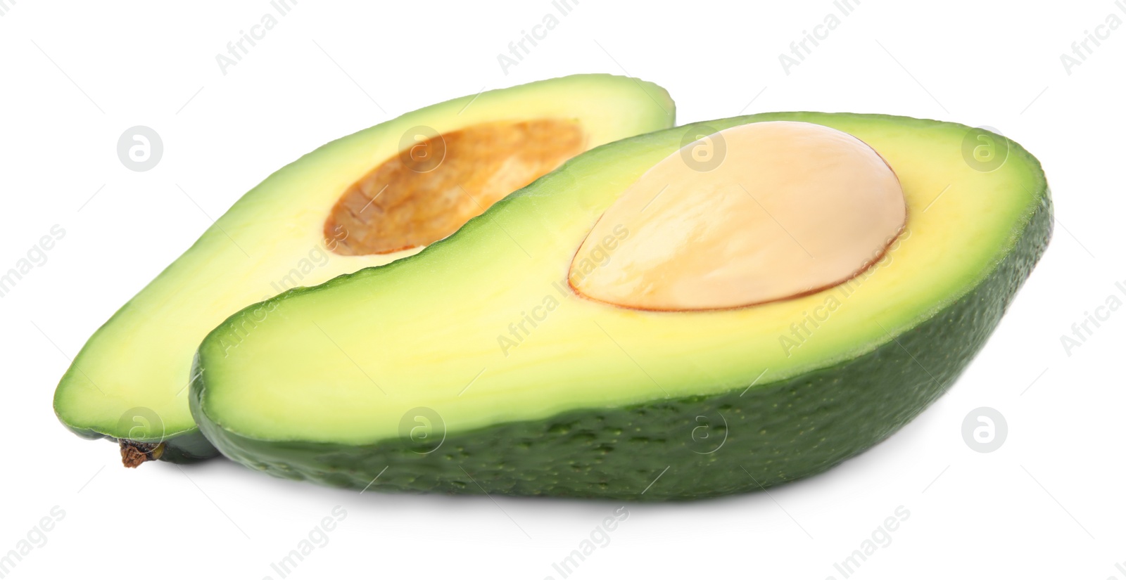 Photo of Cut tasty ripe avocados on white background. Tropical fruit