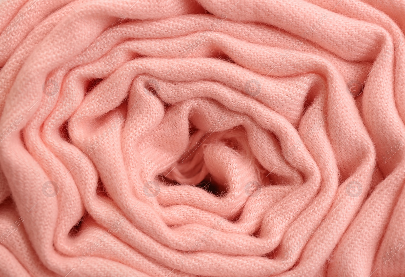 Photo of Elegant peach cloth as background, closeup view