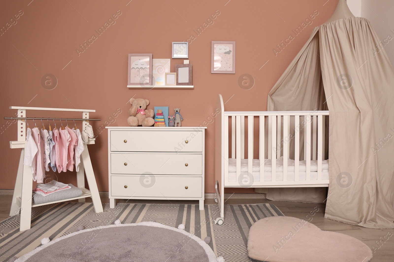 Photo of Baby room interior with stylish furniture and comfortable crib