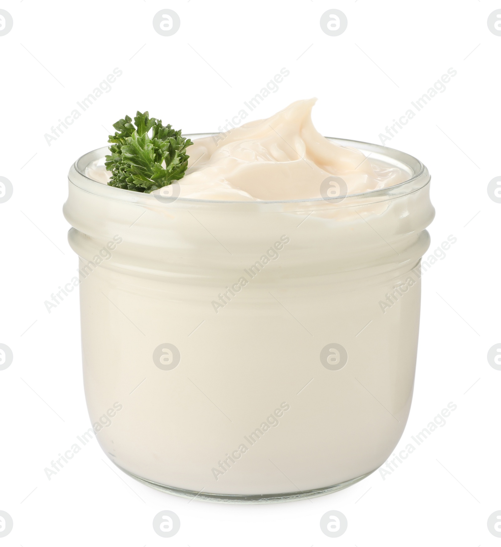 Photo of Mayonnaise with parsley in glass jar isolated on white