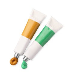 Photo of Tubes with oil paints on white background, top view