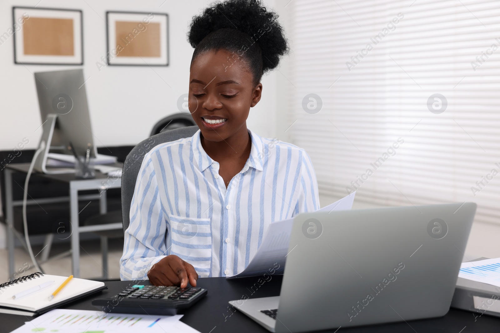 Photo of Professional accountant working at desk in office