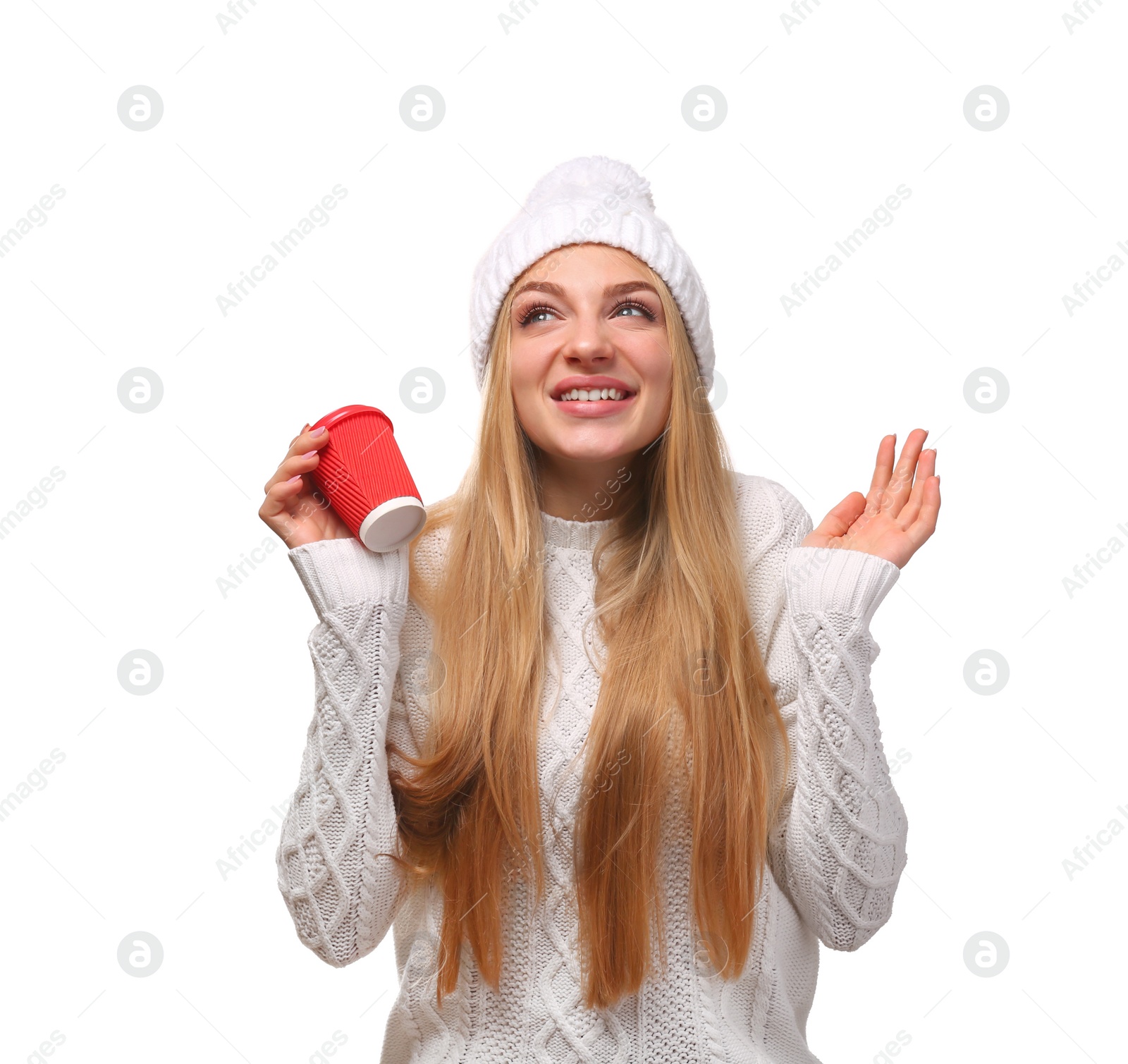 Photo of Portrait of young woman in stylish hat and sweater with coffee paper cup on white background. Winter atmosphere