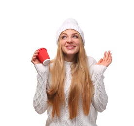 Portrait of young woman in stylish hat and sweater with coffee paper cup on white background. Winter atmosphere
