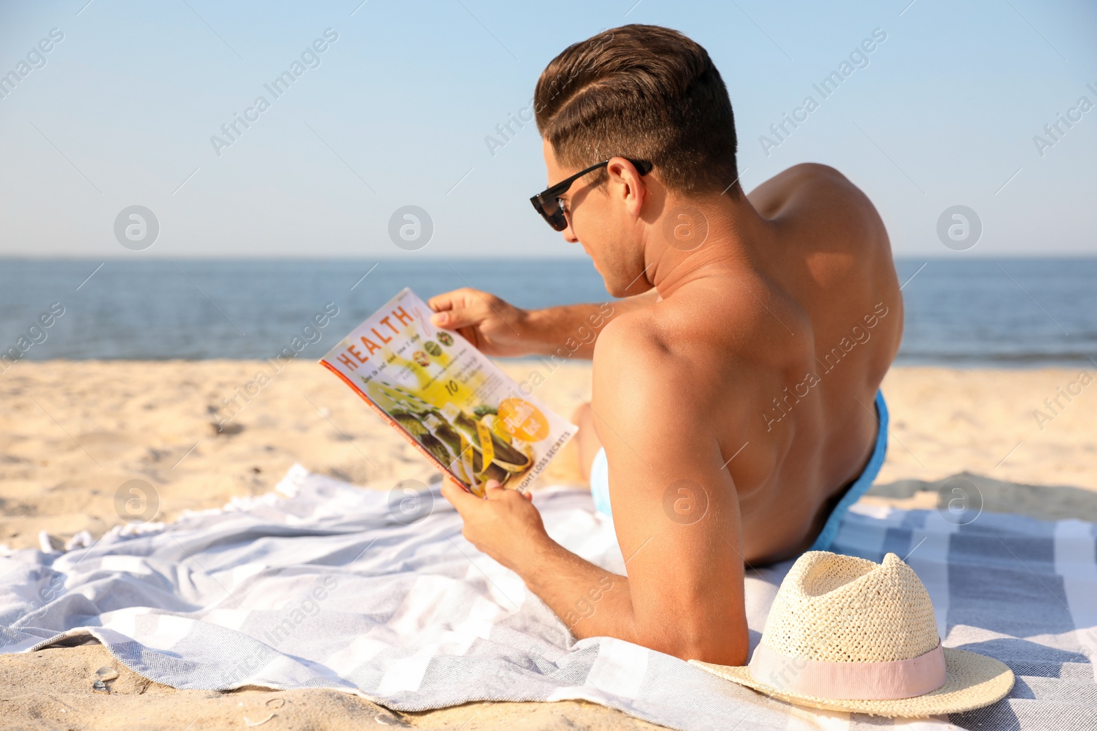 Photo of Man with slim body resting on beach