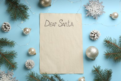 Flat lay composition with letter saying Dear Santa on light blue background. Space for text