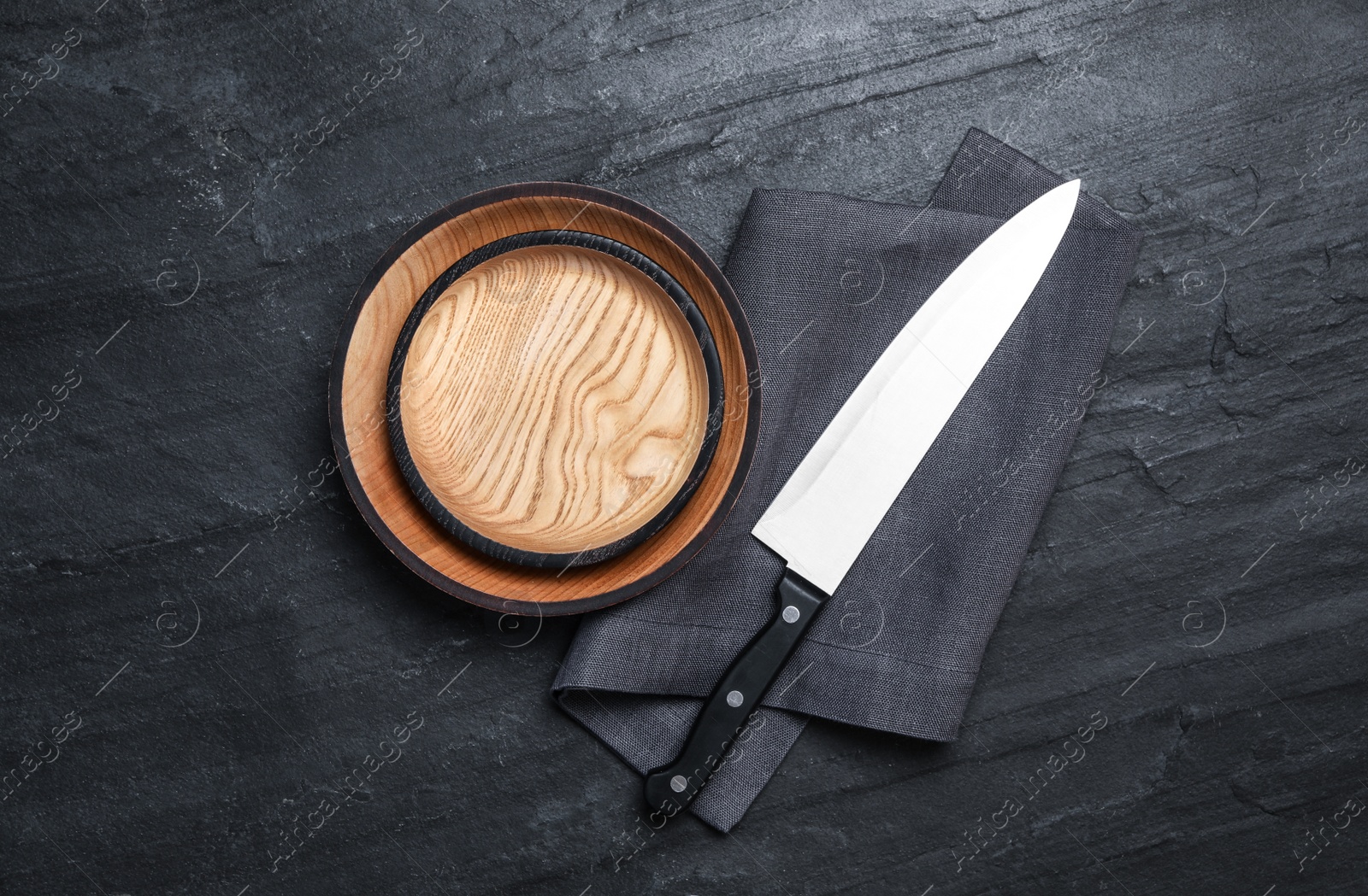 Photo of Cooking utensils on black table, flat lay