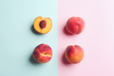 Photo of Fresh ripe peaches on color background, flat lay