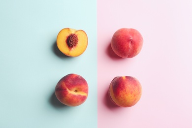 Fresh ripe peaches on color background, flat lay