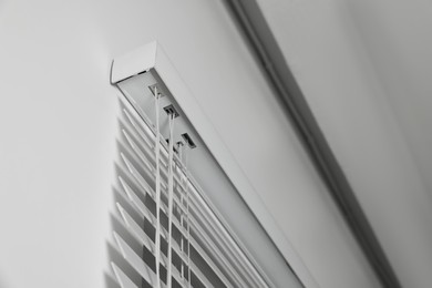 Closeup view of horizontal blinds on window indoors