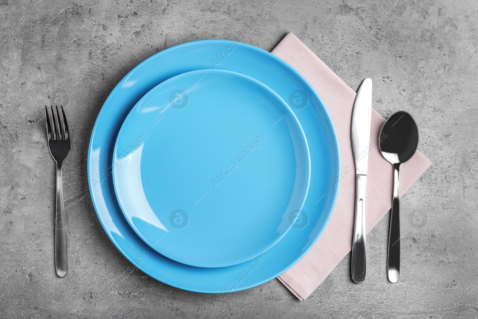 Photo of Stylish elegant table setting on stone surface, top view