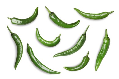 Set with green hot chili peppers on white background