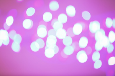 Photo of Beautiful glowing lights as background. Bokeh effect