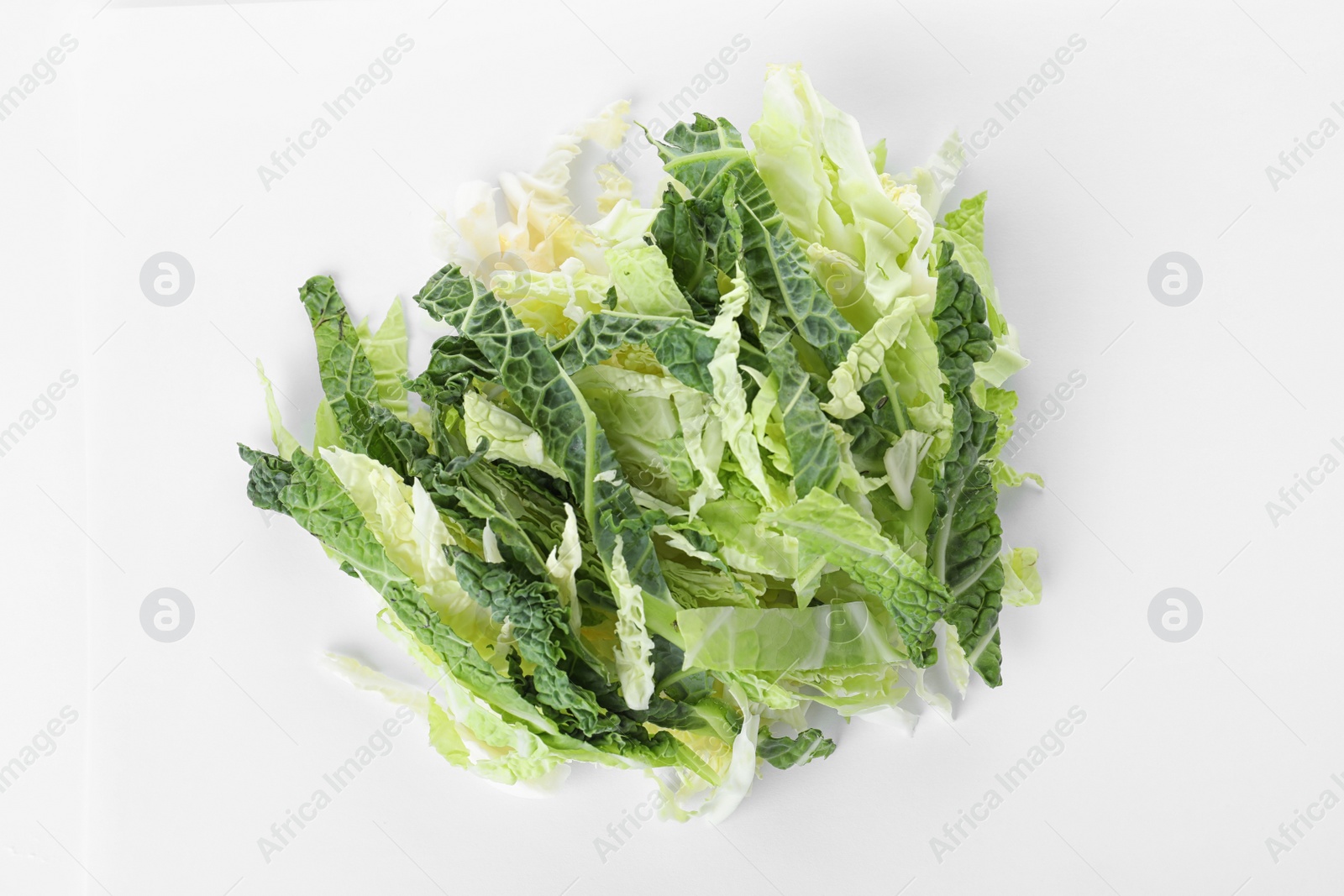 Photo of Pile of chopped fresh green savoy cabbage on white background, top view