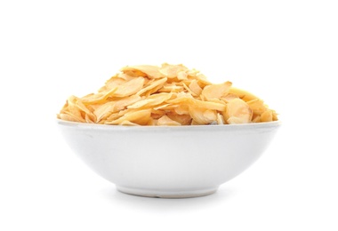 Photo of Dried garlic flakes in bowl on white background