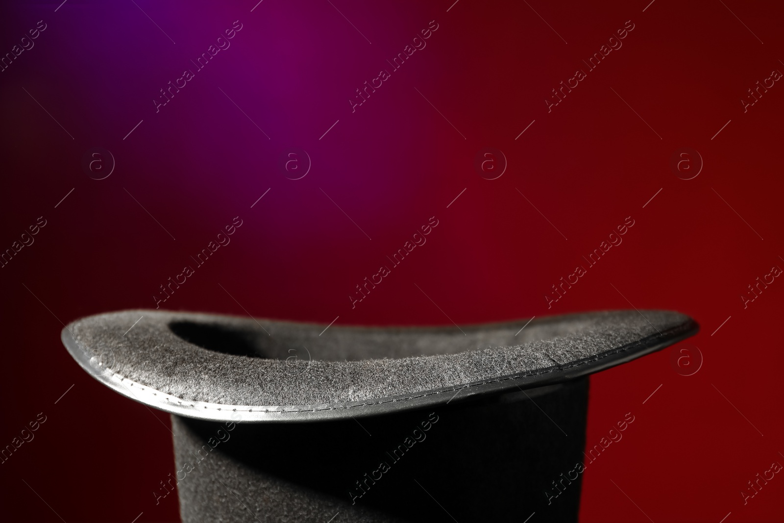 Photo of Magician's hat on color background, space for text