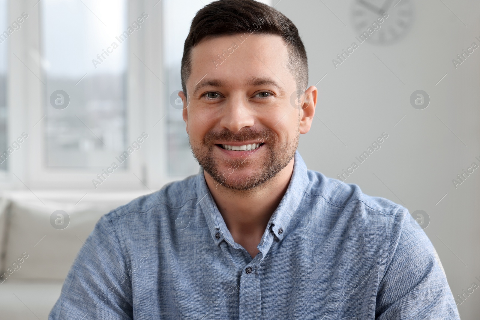 Photo of Happy man having video call at home, view from web camera