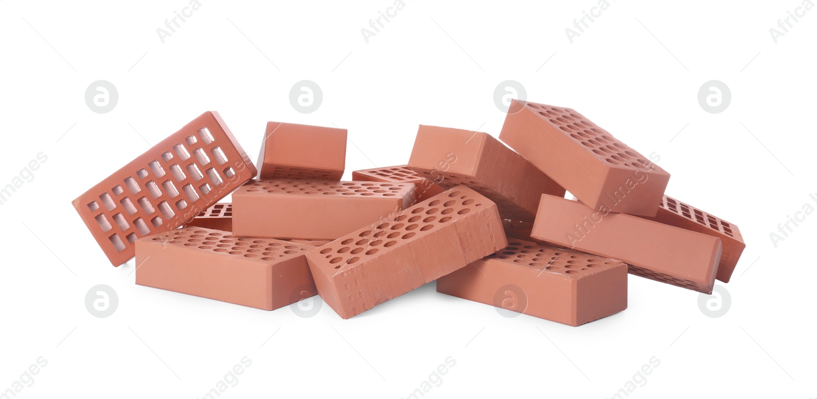 Photo of Pile of red bricks on white background. Building material