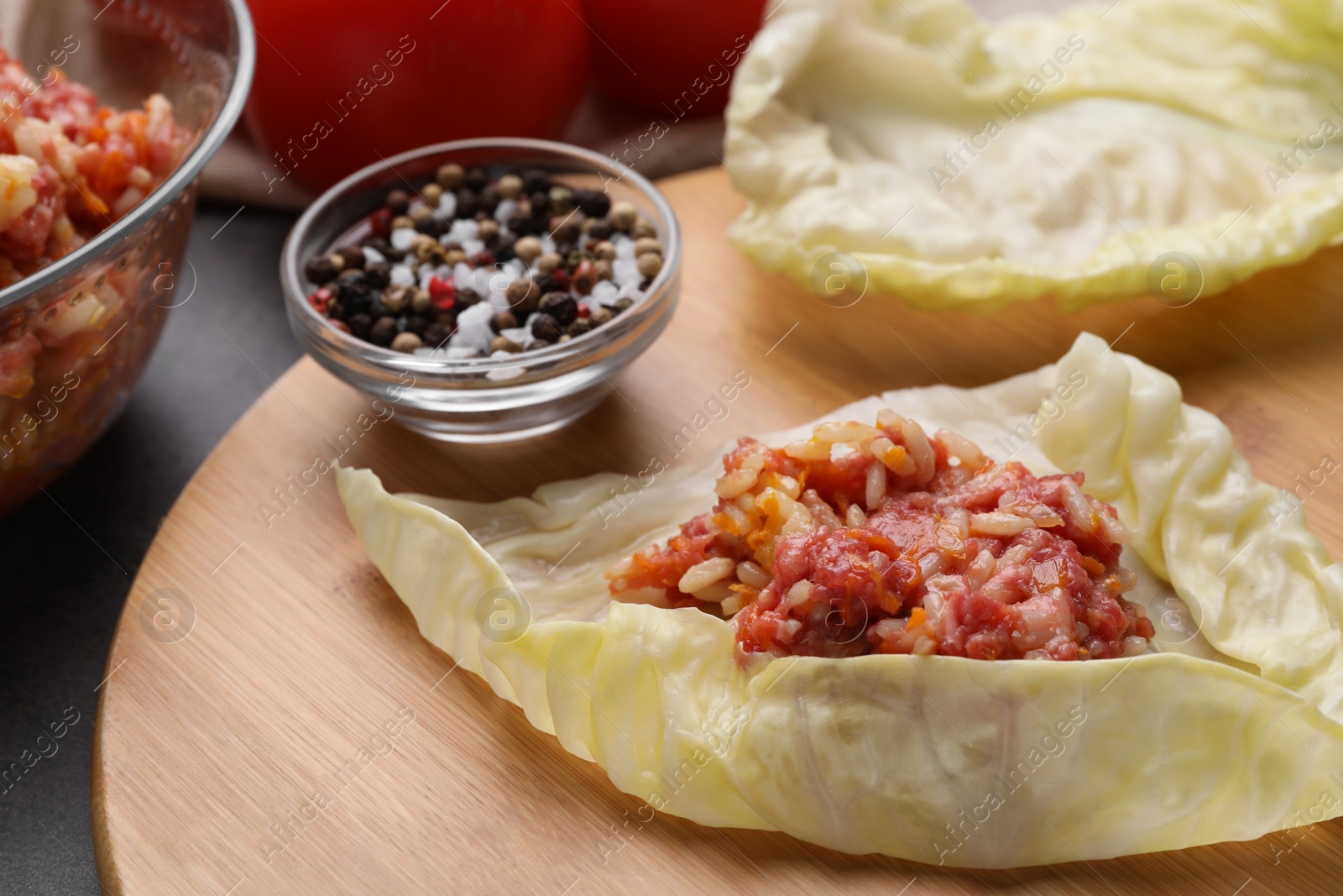 Photo of Ingredients for preparing stuffed cabbage rolls on table, closeup