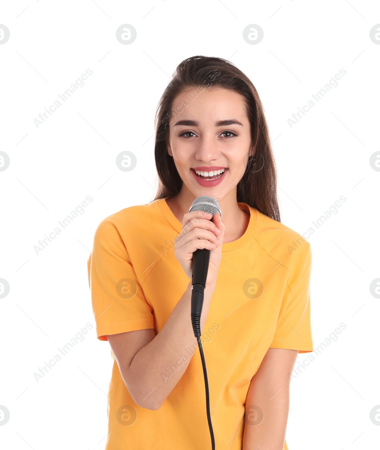 Photo of Young woman in casual clothes posing with microphone on white background