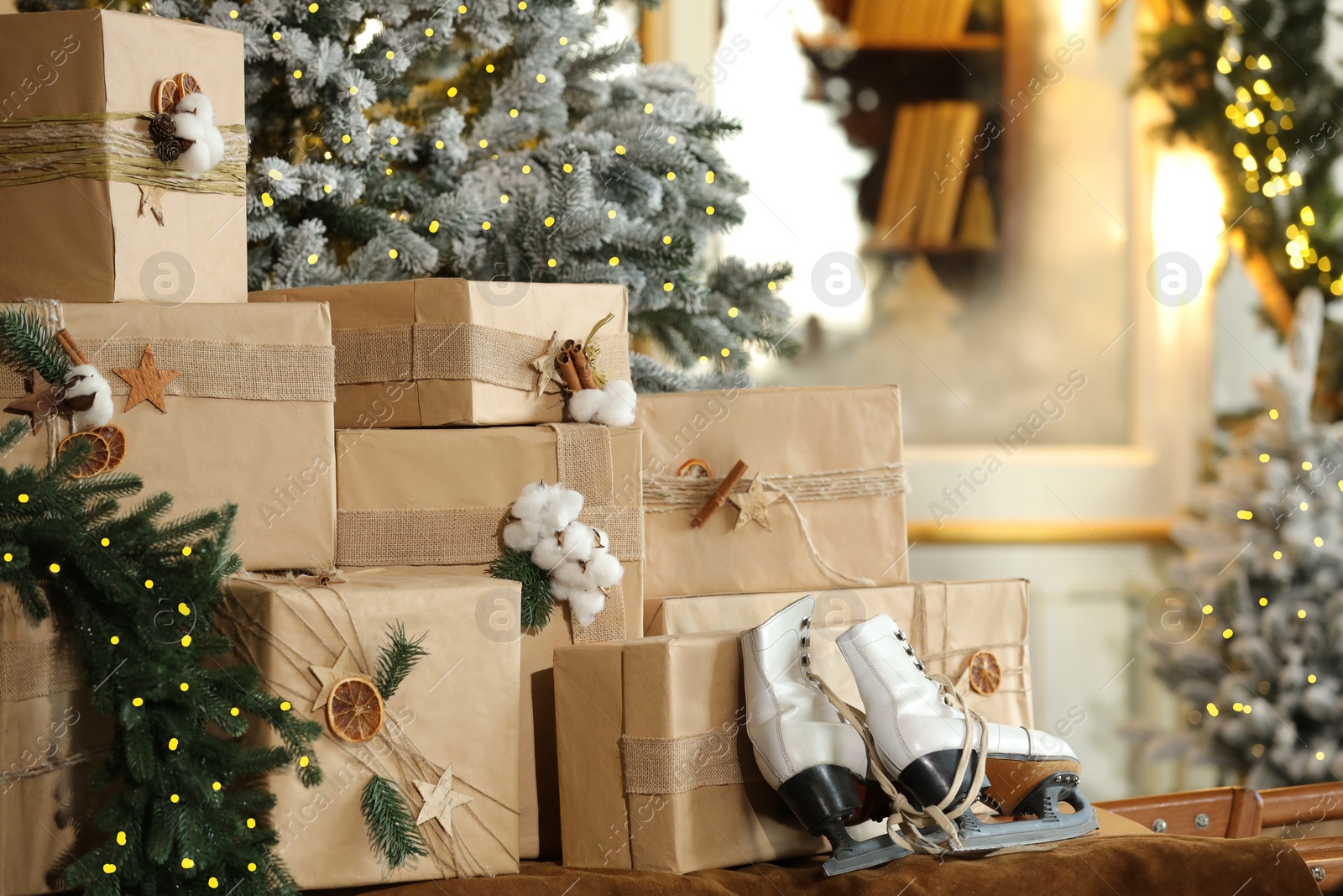 Photo of Many gift boxes near decorated Christmas tree at home, closeup