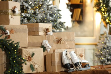 Photo of Many gift boxes near decorated Christmas tree at home, closeup