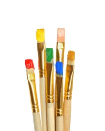 Photo of Brushes with bright paints on white background