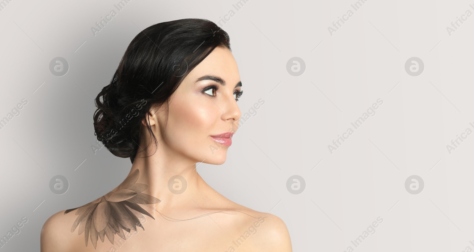 Image of Young woman with beautiful flower tattoo on light background, space for text. Banner design