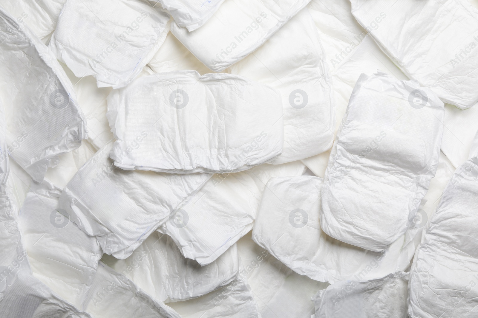 Photo of Baby diapers as background, top view. Child's garment