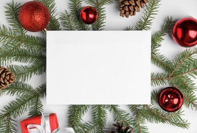 Photo of Beautiful Christmas decor and blank card on white background, flat lay